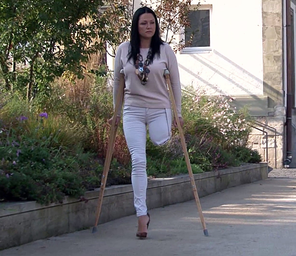 Crutching amputee lady